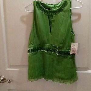 Emerald green tank style blouse.  It can be a party style or casual.